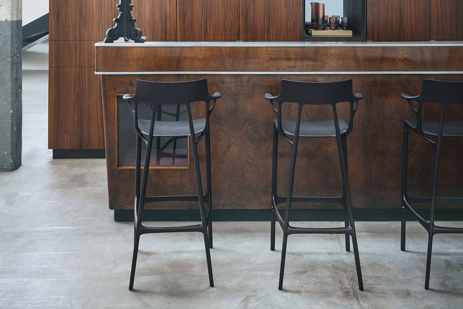A.I. Bar Stools in black finish in bar setting