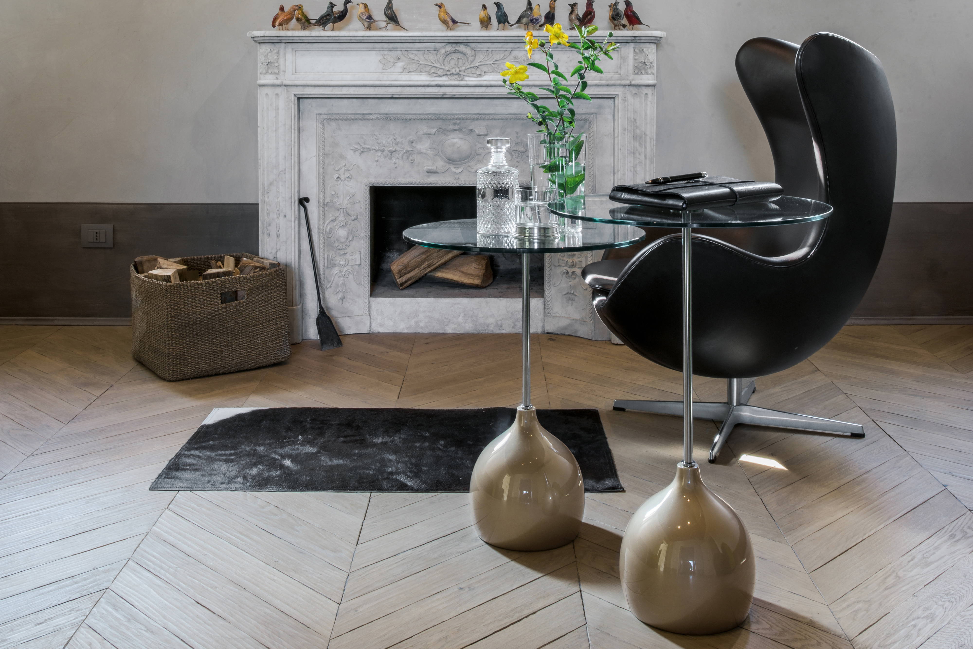 Adachi end tables with a glossy champagne base and extra clear glass top