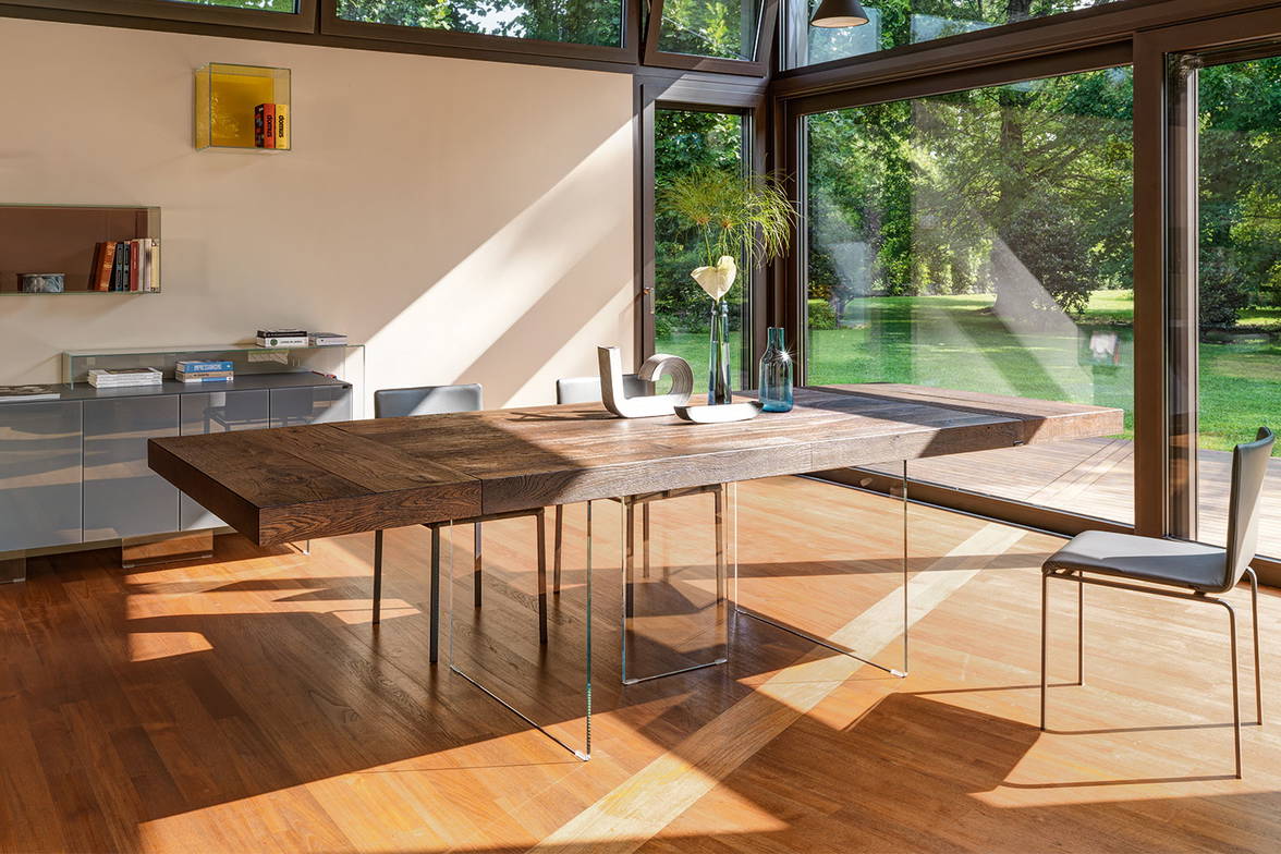 Air extension wood dining table by Lago in a dining room setting Air extension wood dining table by Lago in a dining room setting