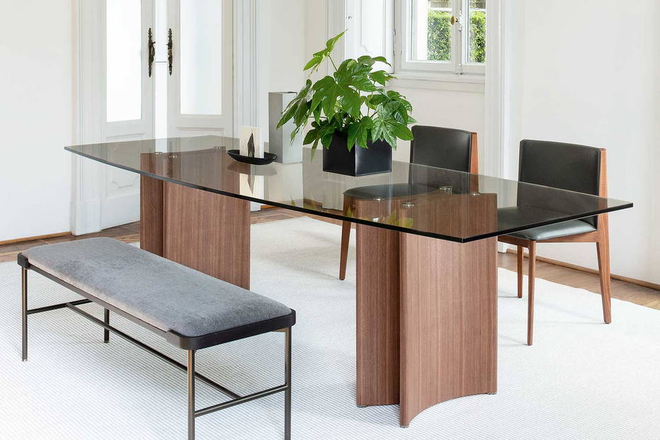 Alan glass barrel double pedestal dining table with Ionis dining chairs by Porada