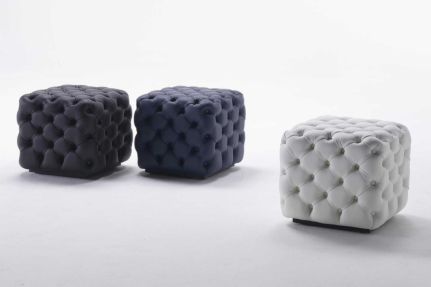 Alcide poufs, black, blue, and white, by Porada