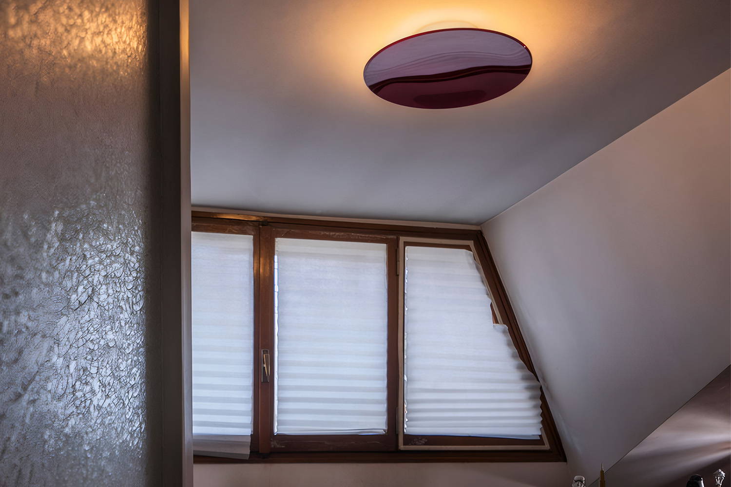 The Anoor flush mount light in red aluminum.