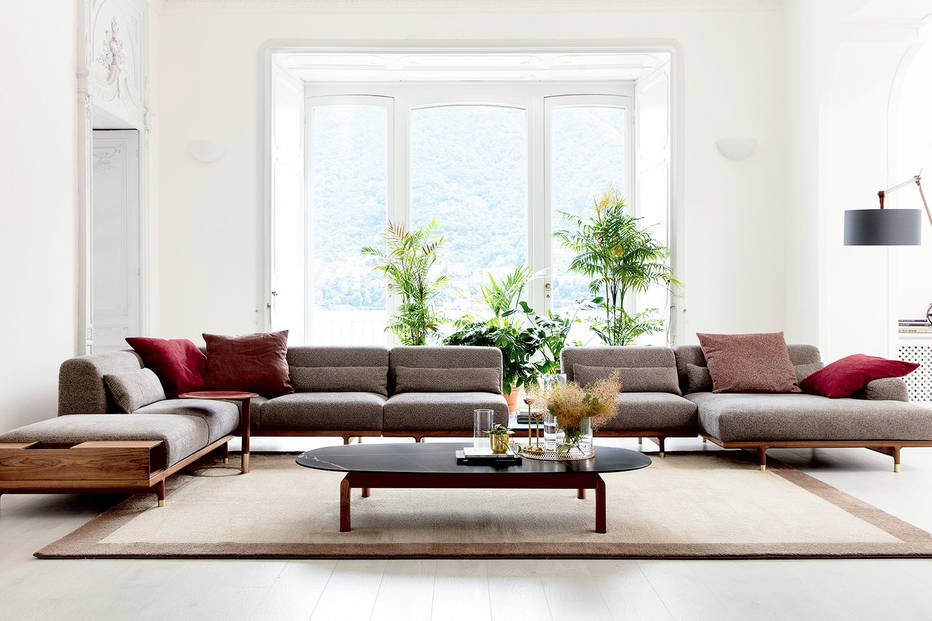Argo sectional sofa with chaise with Quay coffee table, Jok end table, and Gary floor lamp by Porada