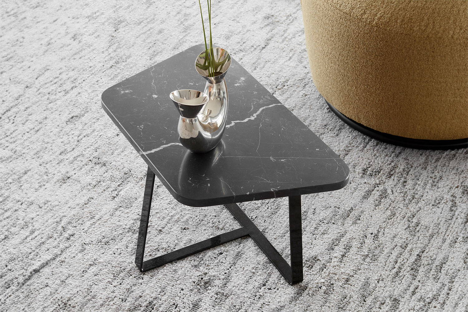 The Astratto End Table in Black Marquinia marble.