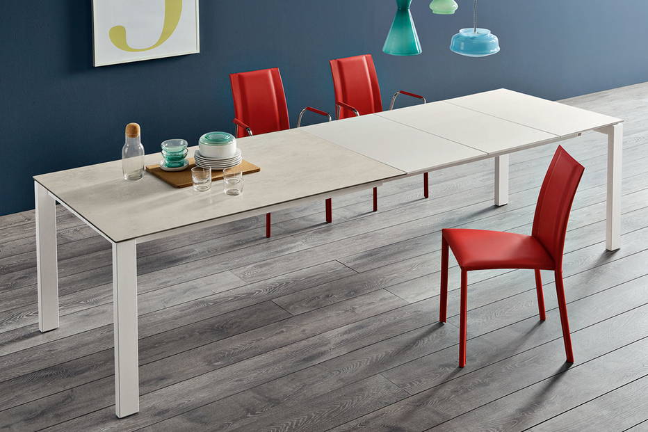 Badu ceramic dining table with Silvy hard leather dining chairs by Midj