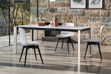 Blade extension dining table with Liu plastic dining chairs by Midj