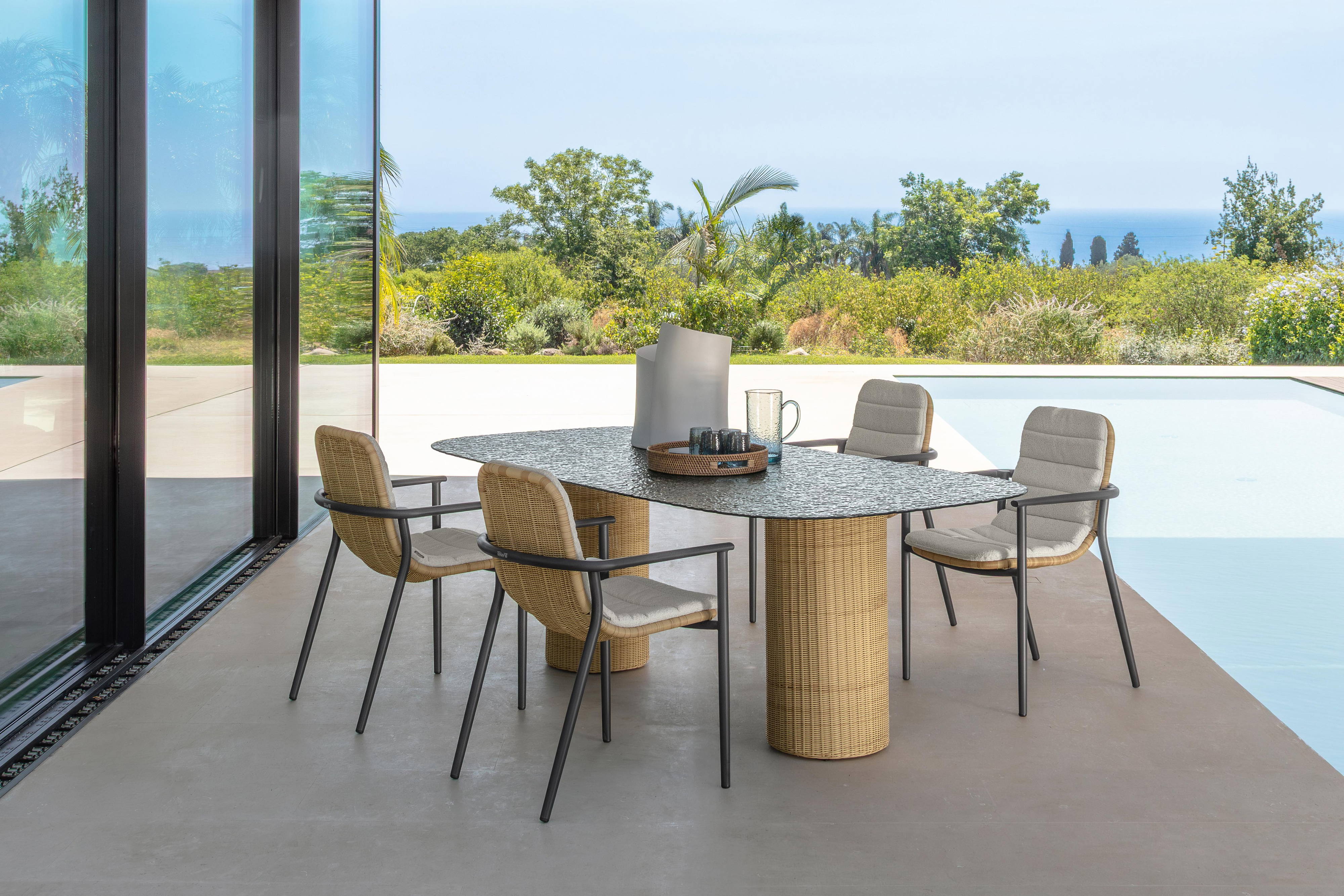 The Bond dining table with Bond dining armchairs.