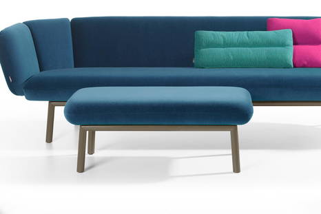 Bras footstool with blue fabric upholstery