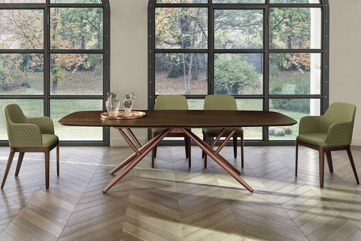 Bridge wood dining table is available in rectangular or barrel shaped tops Bridge wood dining table is available in rectangular or barrel shaped tops