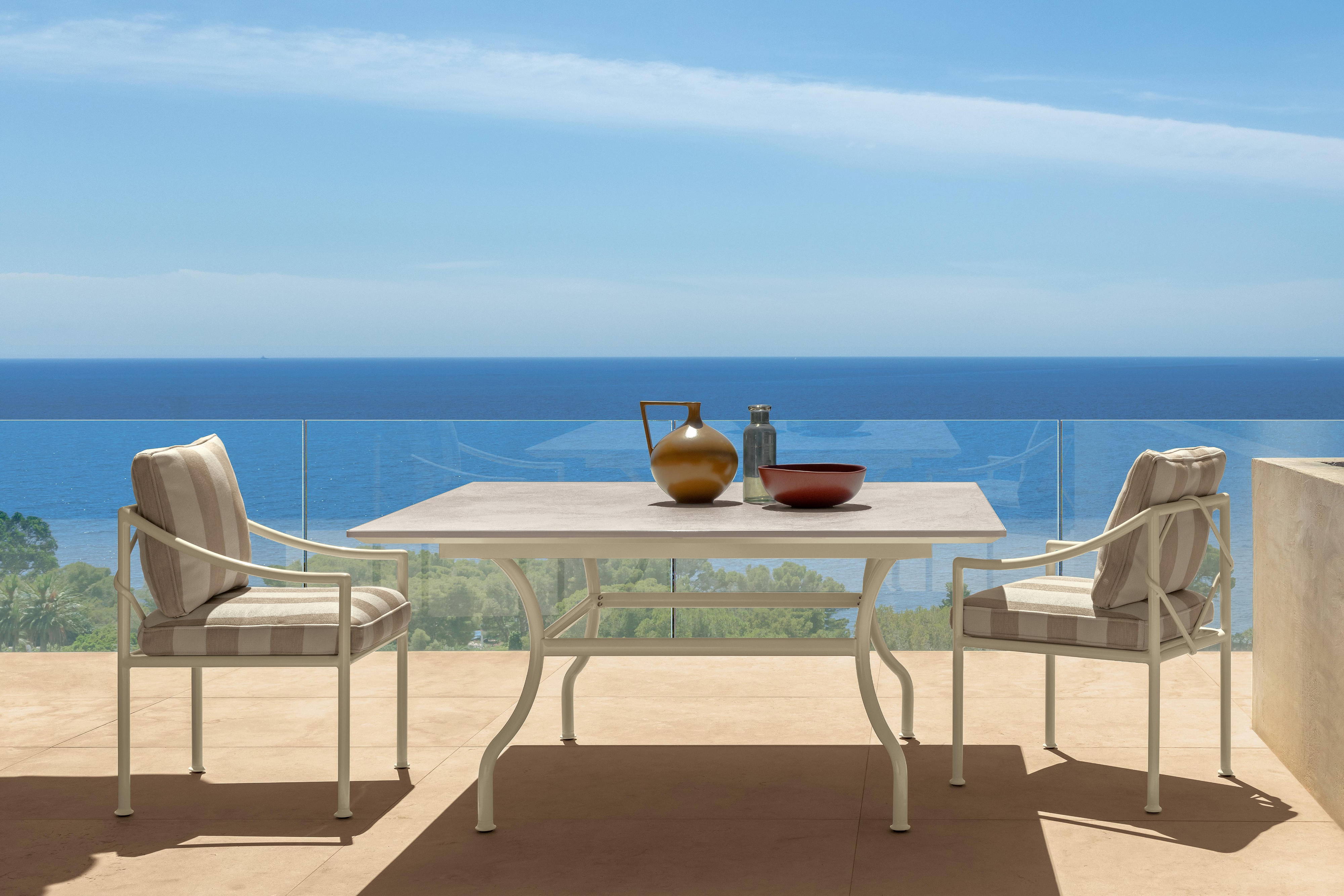 The Capri bistro table with Capri dining armchairs