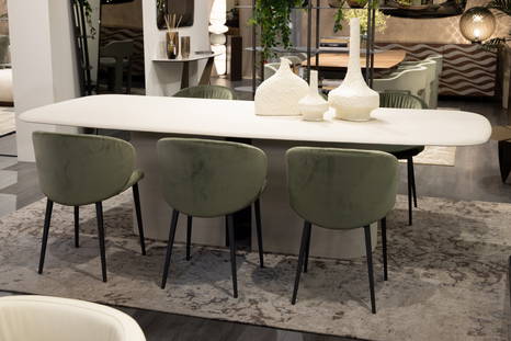 Chamotte Dining Table with Primitivi Vases, Mezzaluna Dining Chairs, and Vintage Rug