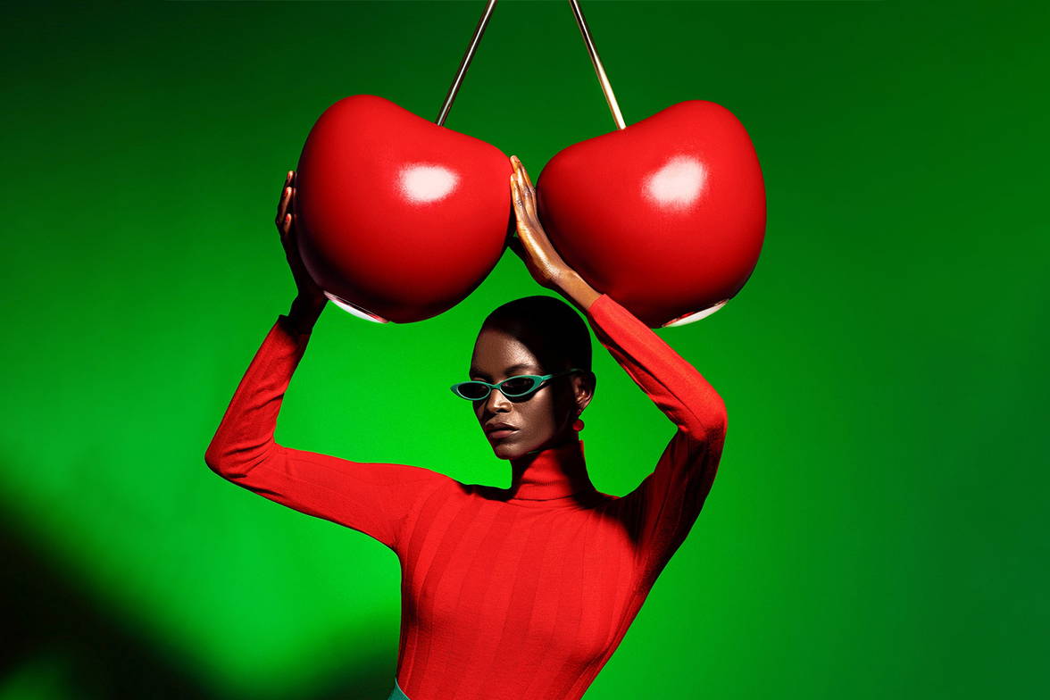 Woman holding the Cherry Pendant Light Woman holding the Cherry Pendant Light