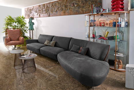 Cocoon angled sectional sofa with Gabbia end tables