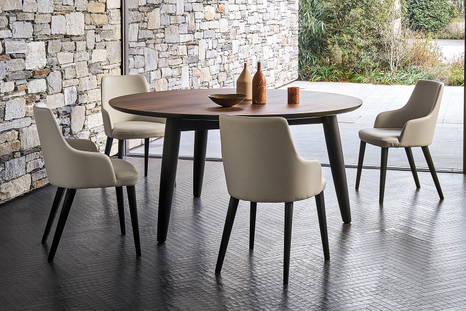 Convivio round dining table with Eva chairs by San Giacomo