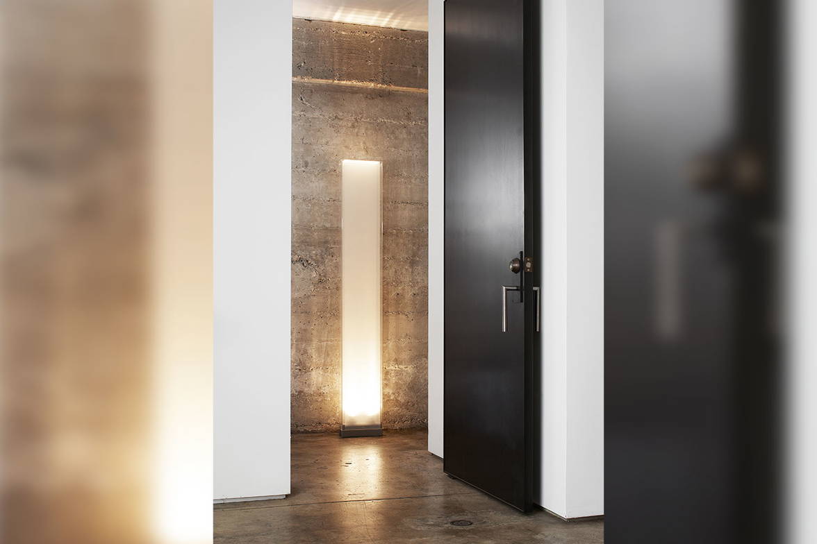 Cortina floor lamp by Pablo Designs in a corridor Cortina floor lamp by Pablo Designs in a corridor