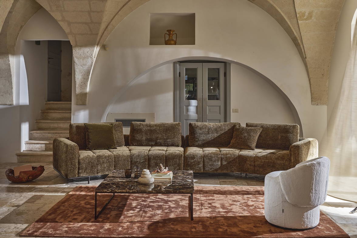 The Cortina Tufted Curved Sectional Sofa is made in Italy. The Cortina Tufted Curved Sectional Sofa is made in Italy.