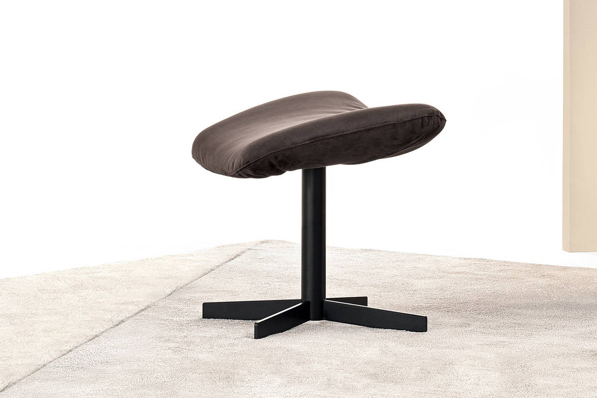 Daya ottoman features a metal base Daya ottoman features a metal base