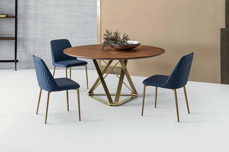 Delta round dining table designed by Bernhardt & Vella