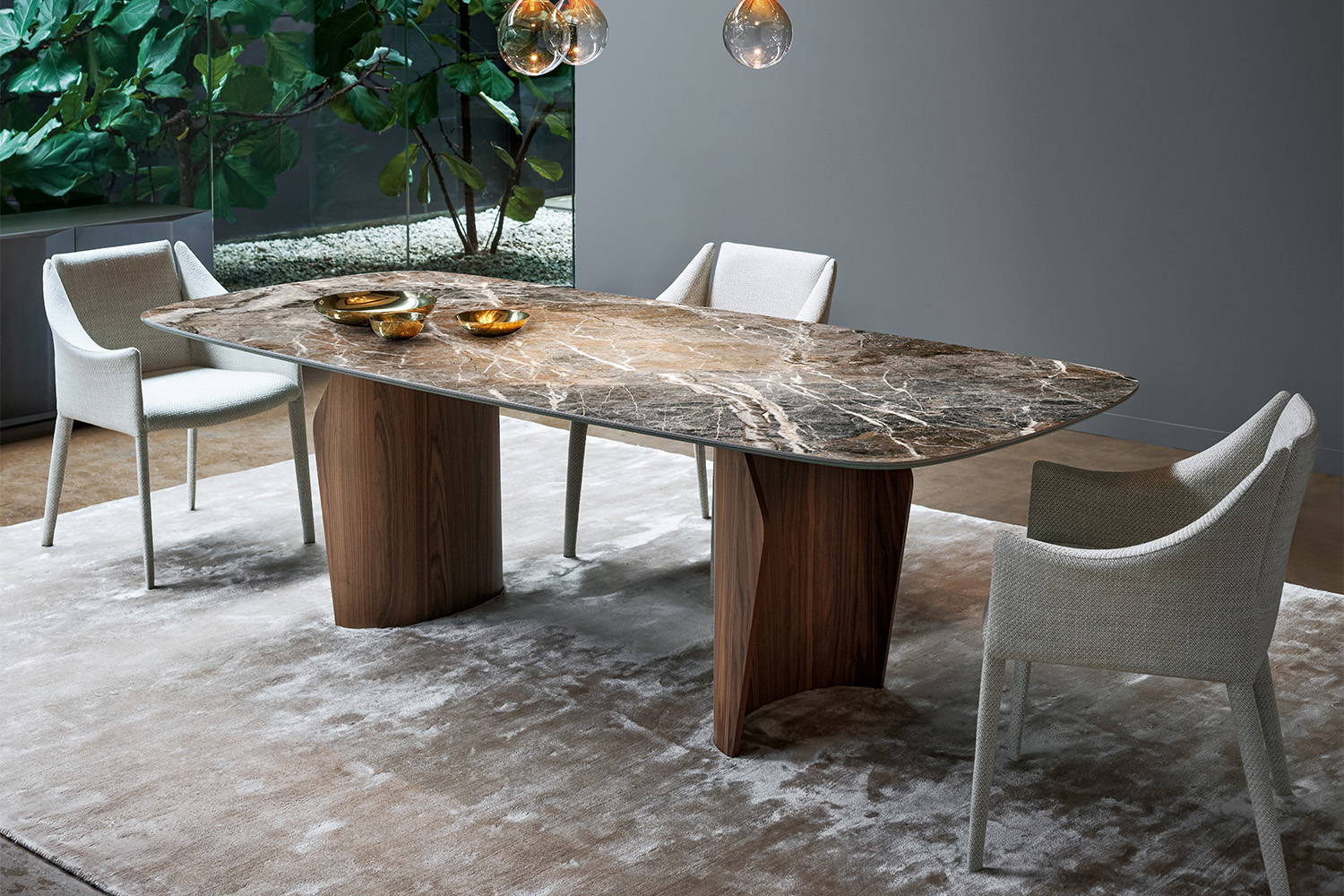 The Flame dining table is available in both oblong and round top shapes