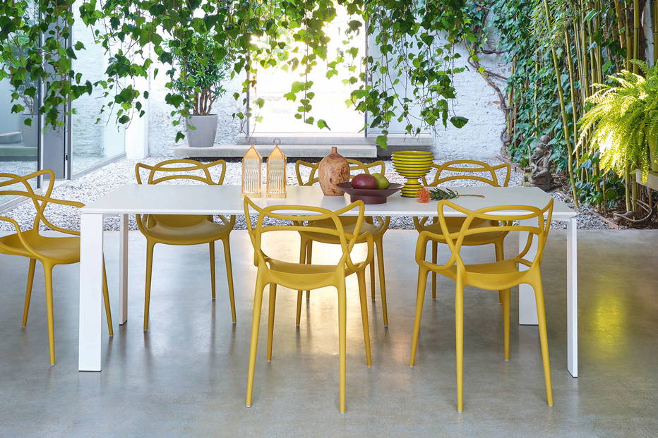 Four Dining Table is available in white and black top finishes