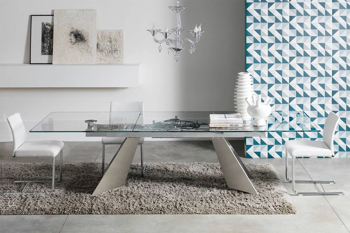 Galax dining table by Naos open in a dining area setting Galax dining table by Naos open in a dining area setting