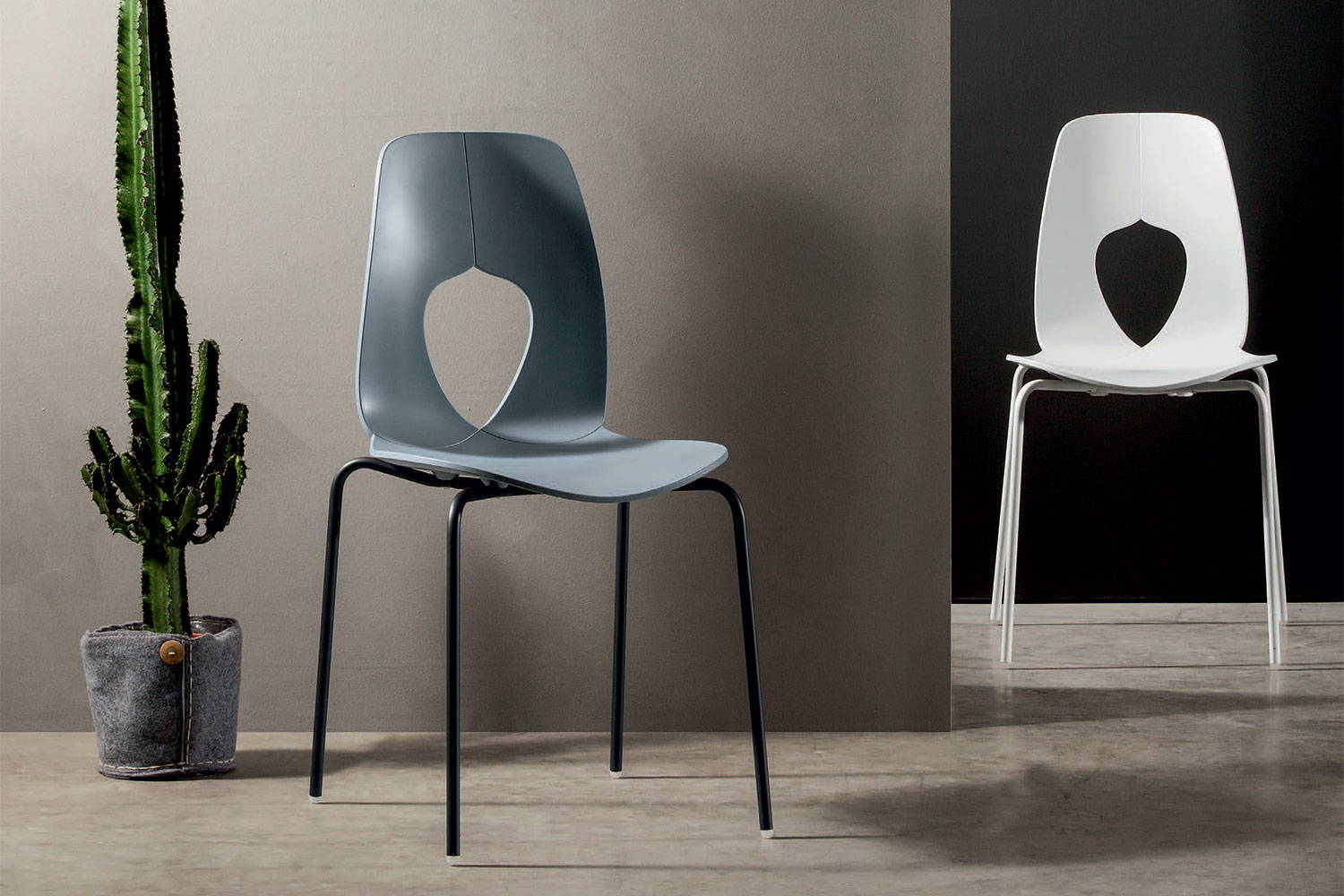 Hole dining chairs in matte white and Cadetto blue-grey