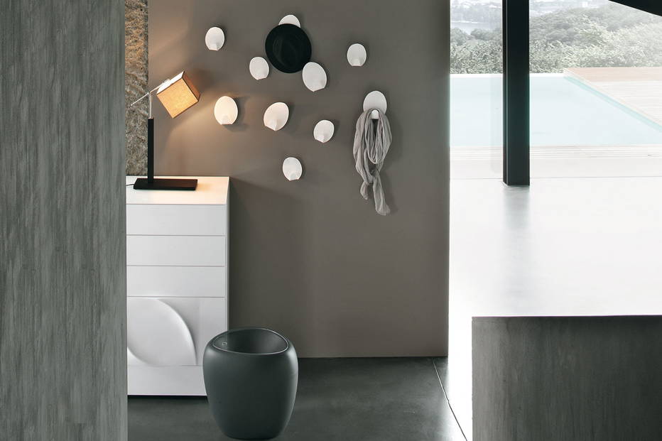 Ivy coat hangers by Tonin Casa in a bedroom setting