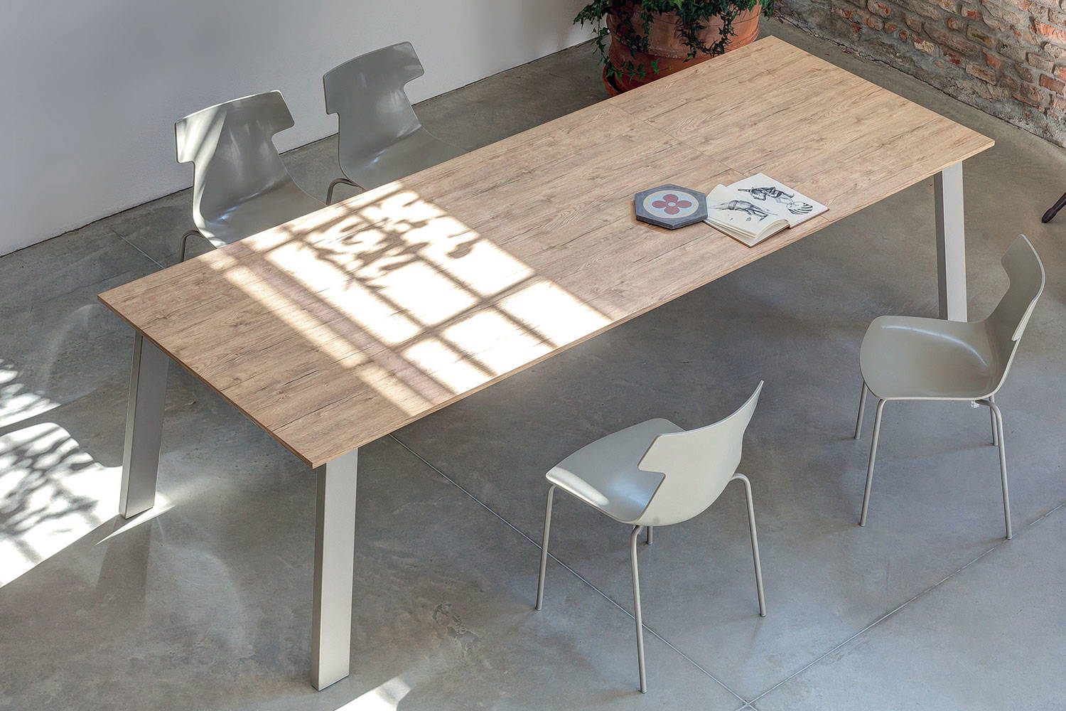 Aerial view of Kalua extension dining table with Guilia dining chairs