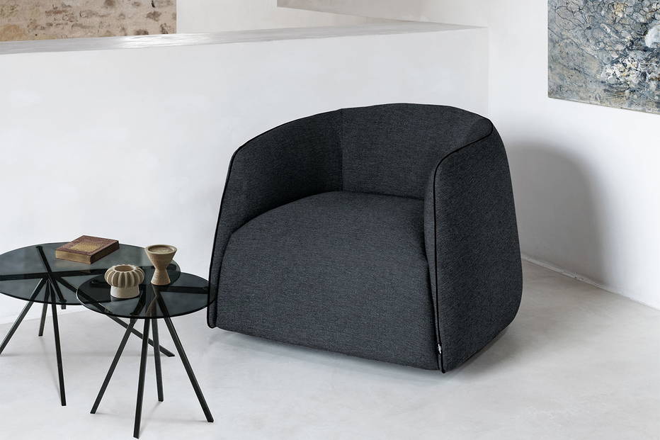 The Kodi armchair in Caviar Gourmet fabric.