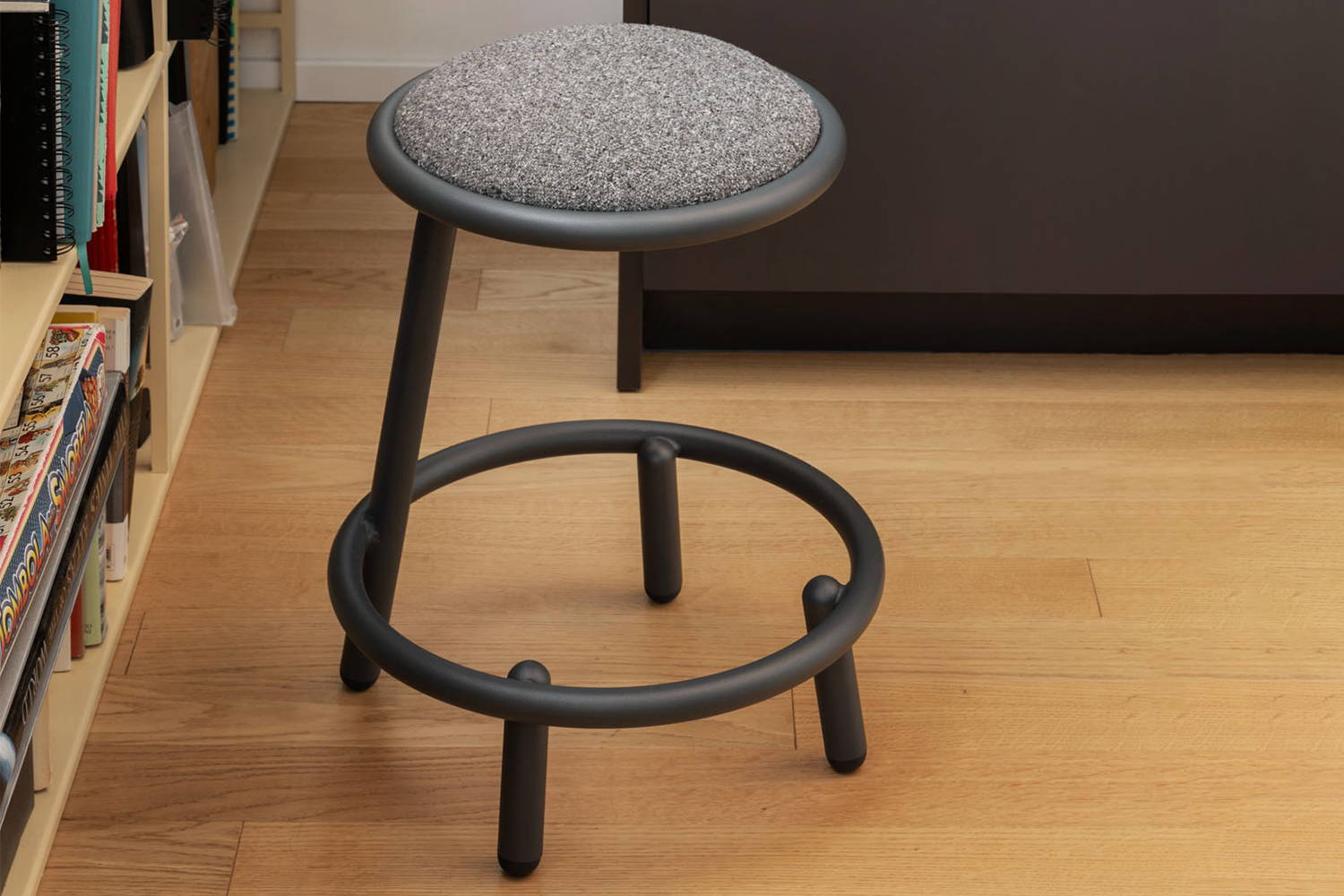 Less Stool by bookcase