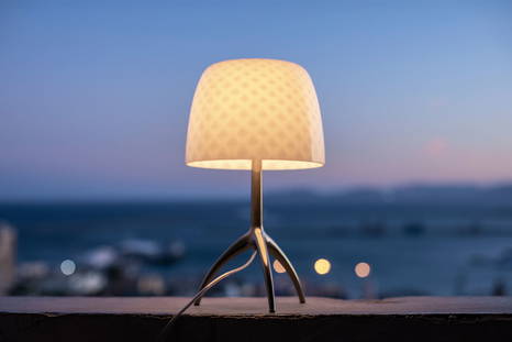 Lumiere 30th table lamp by Foscarini with the light turned on 