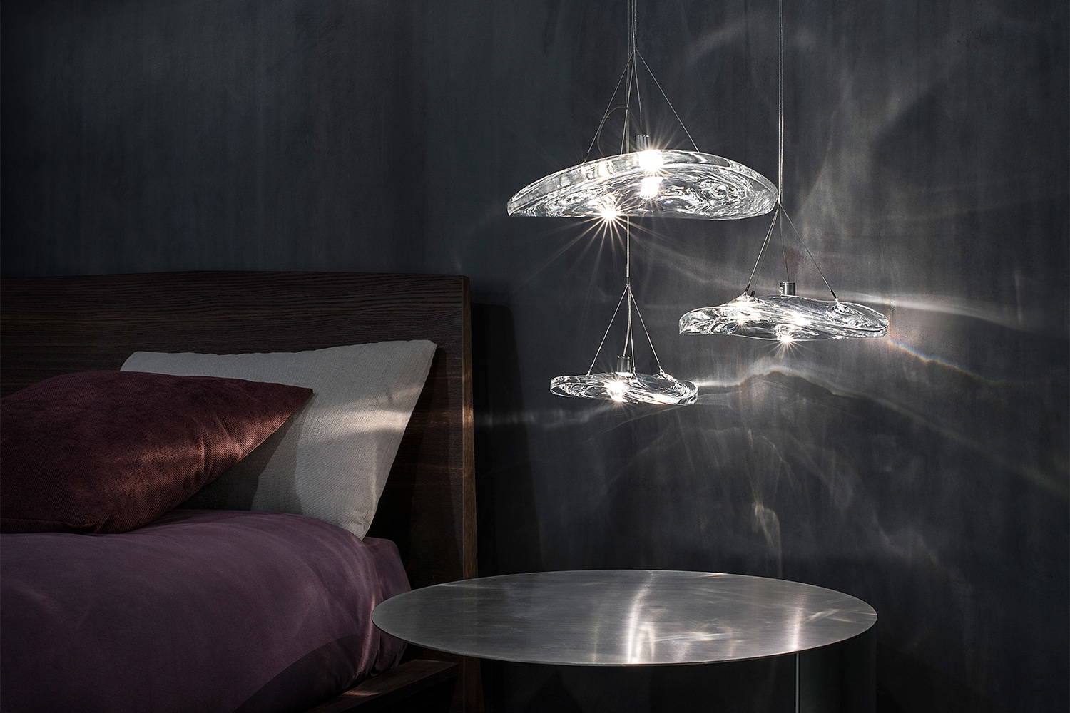 Manta 3pc suspension light by Terzani in a bedroom setting