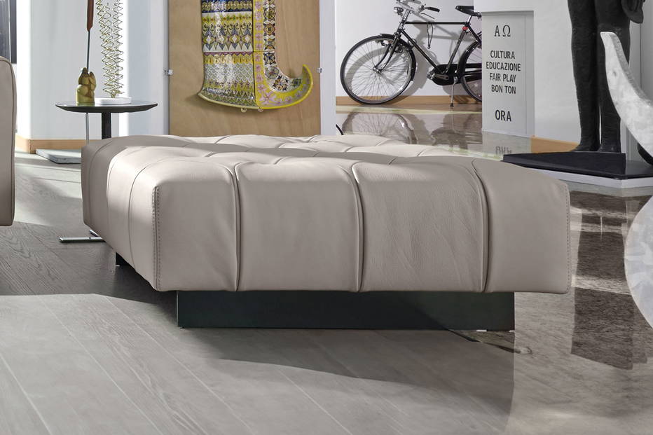 Marlon ottoman upholstered in leather