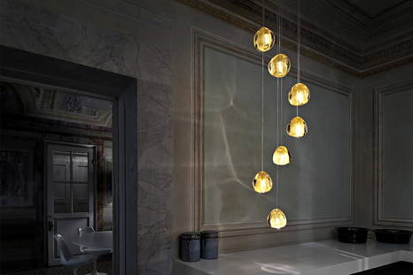 Mizu suspension light by Terzani in a dining area