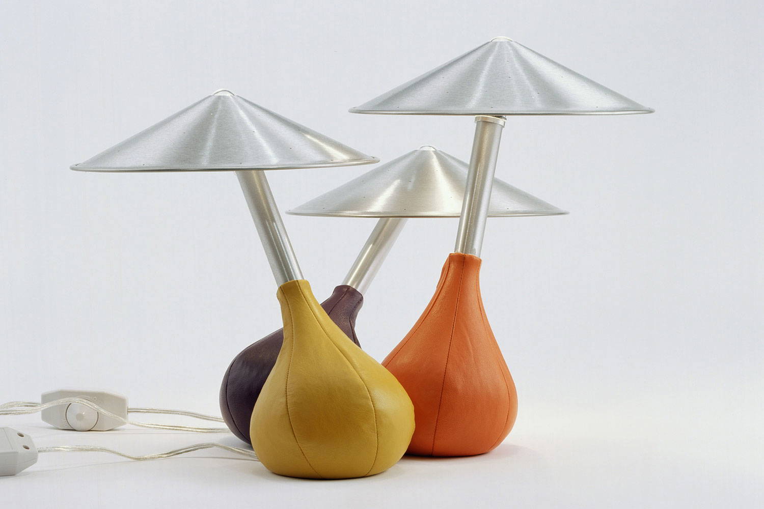 Piccola table lamps by Pablo in mustard, tangerine and purple colors