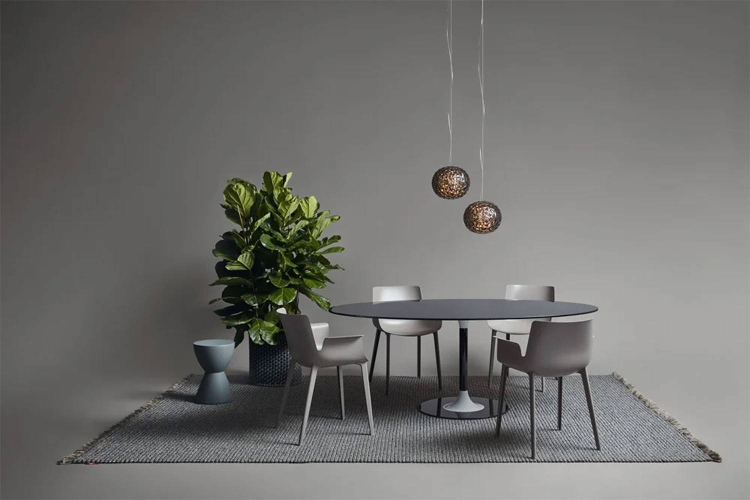 Planet suspension lights above Thierry XXL dining table