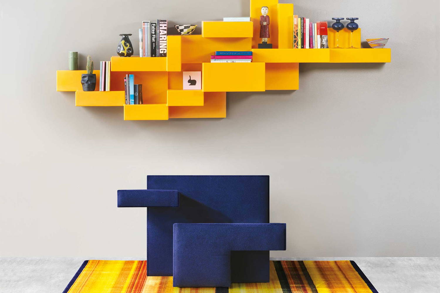 The Primitive armchair with the Primitive bookshelf.