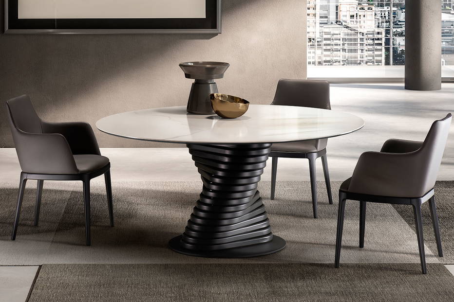 Rotolo round dining table is features a stylish, modern and unique base