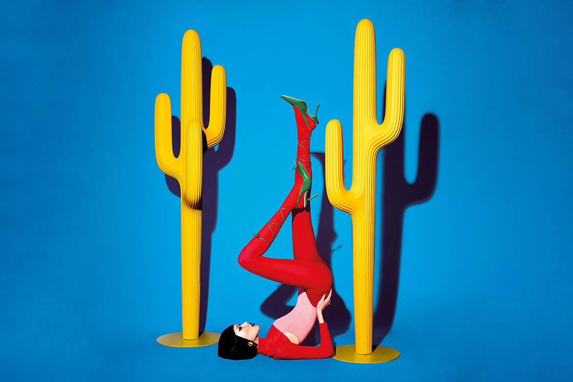 Woman with two yellow Saguaro Coat Racks Woman with two yellow Saguaro Coat Racks