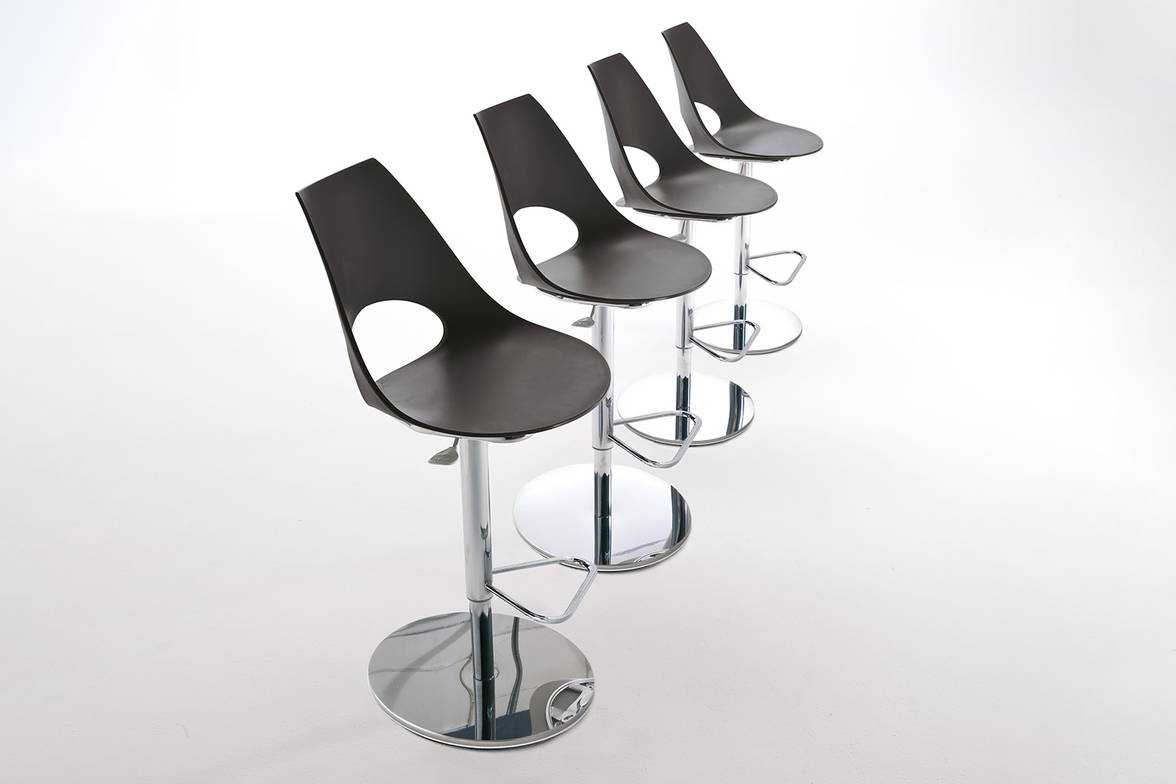 Shark adjustable bar stool features a polypropylene seating shell Shark adjustable bar stool features a polypropylene seating shell