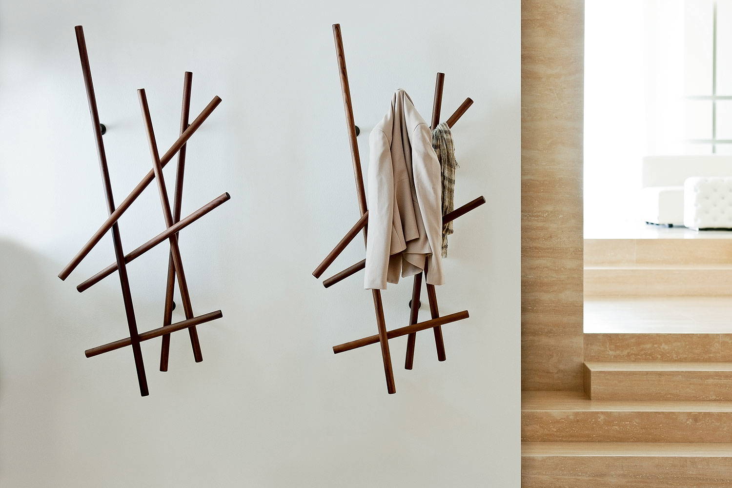Sketch coat racks in a living room setting by Porada