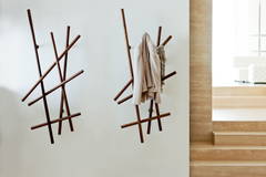 Sketch coat racks in a living room setting by Porada