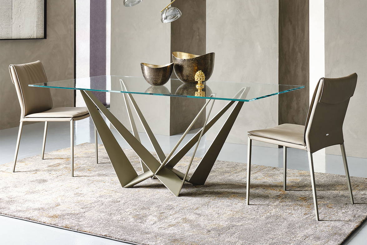 The Skorpio dining table with Isabel dining chairs. The Skorpio dining table with Isabel dining chairs.