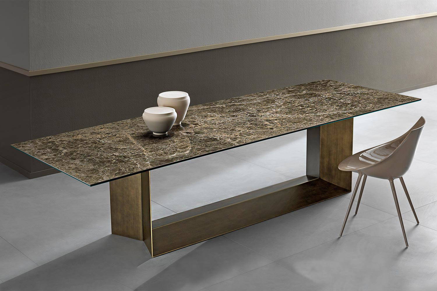 T5 ceramic dining table with a brushed bronze base and polished Emperador ceramic top
