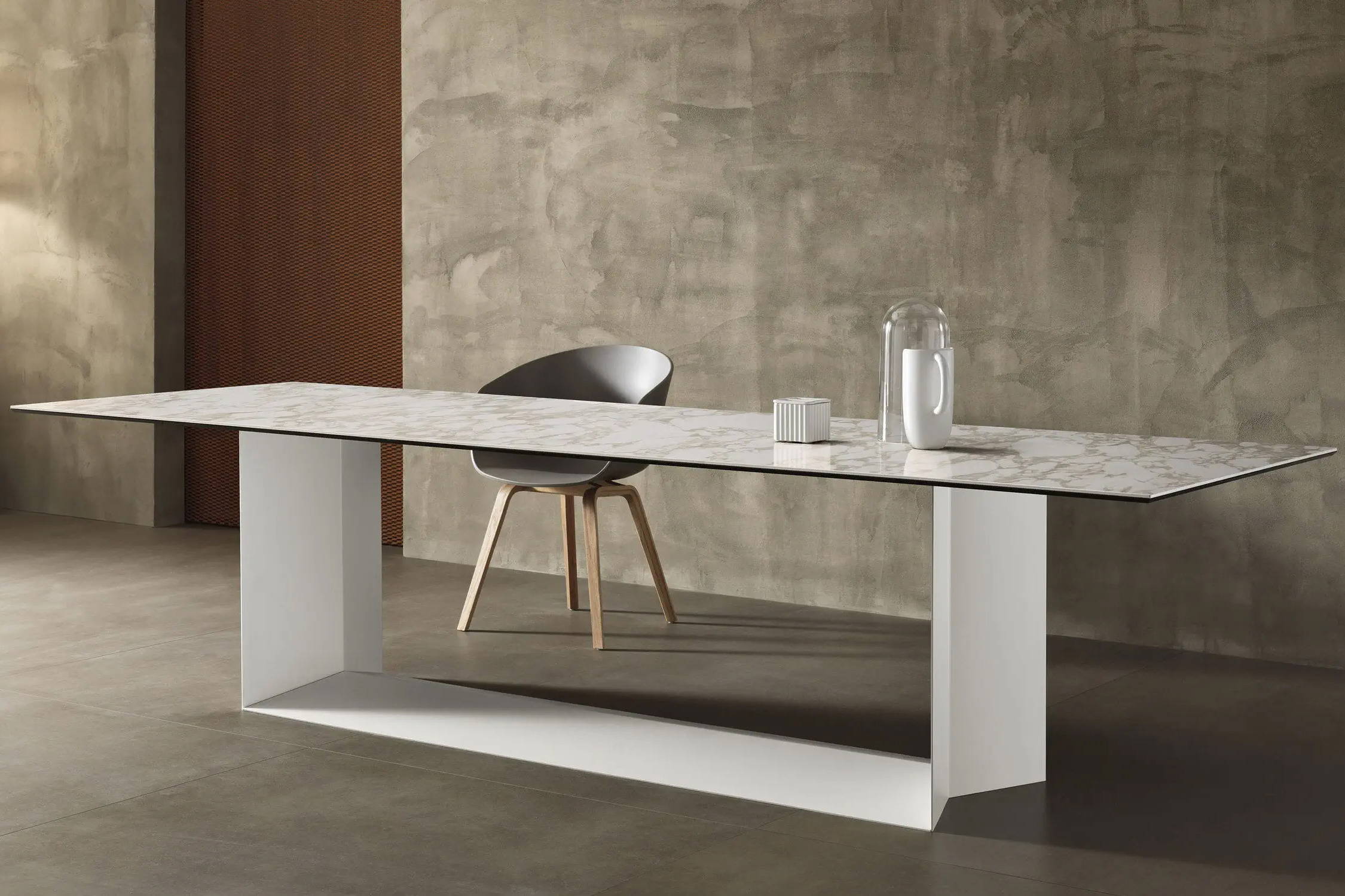 T5 ceramic dining table with a matte white base and arabesque Calacatta ceramic top