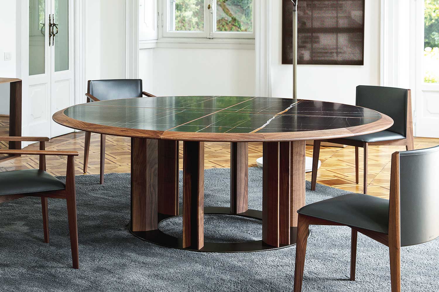 Thayl round dining table with Ionis dining chairs by Porada