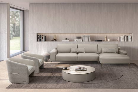 The Twiga sectional with Sophie armchairs and a Sphere coffee table.