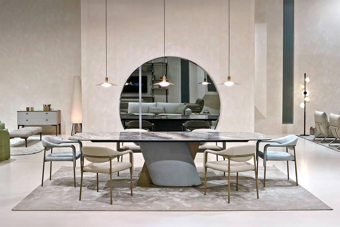 The Venus dining table with various upholstered Spider dining chairs. The Venus dining table with various upholstered Spider dining chairs.