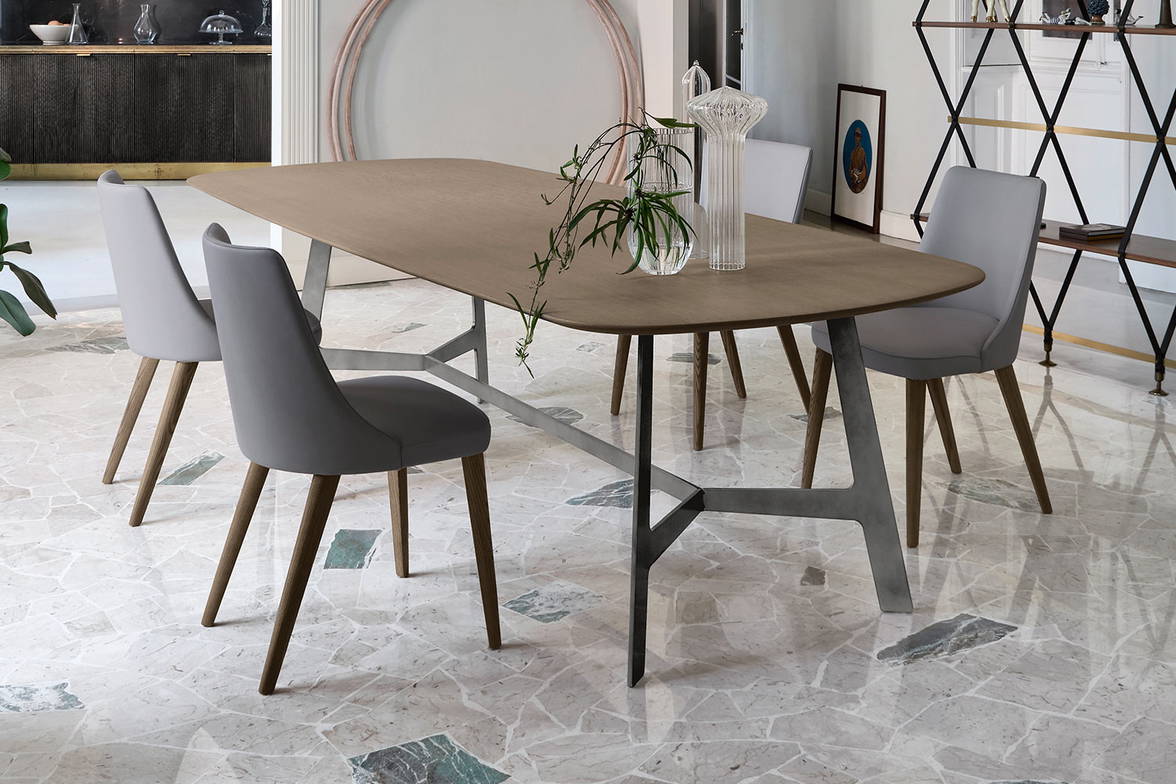 Vertigo wood dining table with Eva chairs by San Giacomo Vertigo wood dining table with Eva chairs by San Giacomo