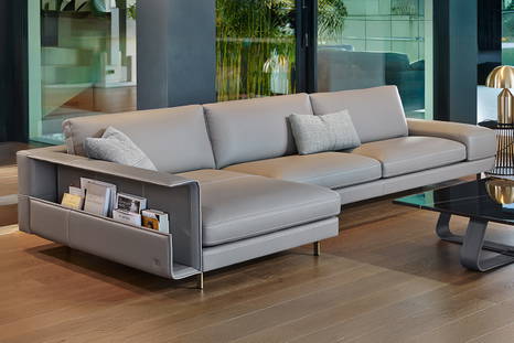 Vincent sectional sofa with chaise and bookcase armrest.